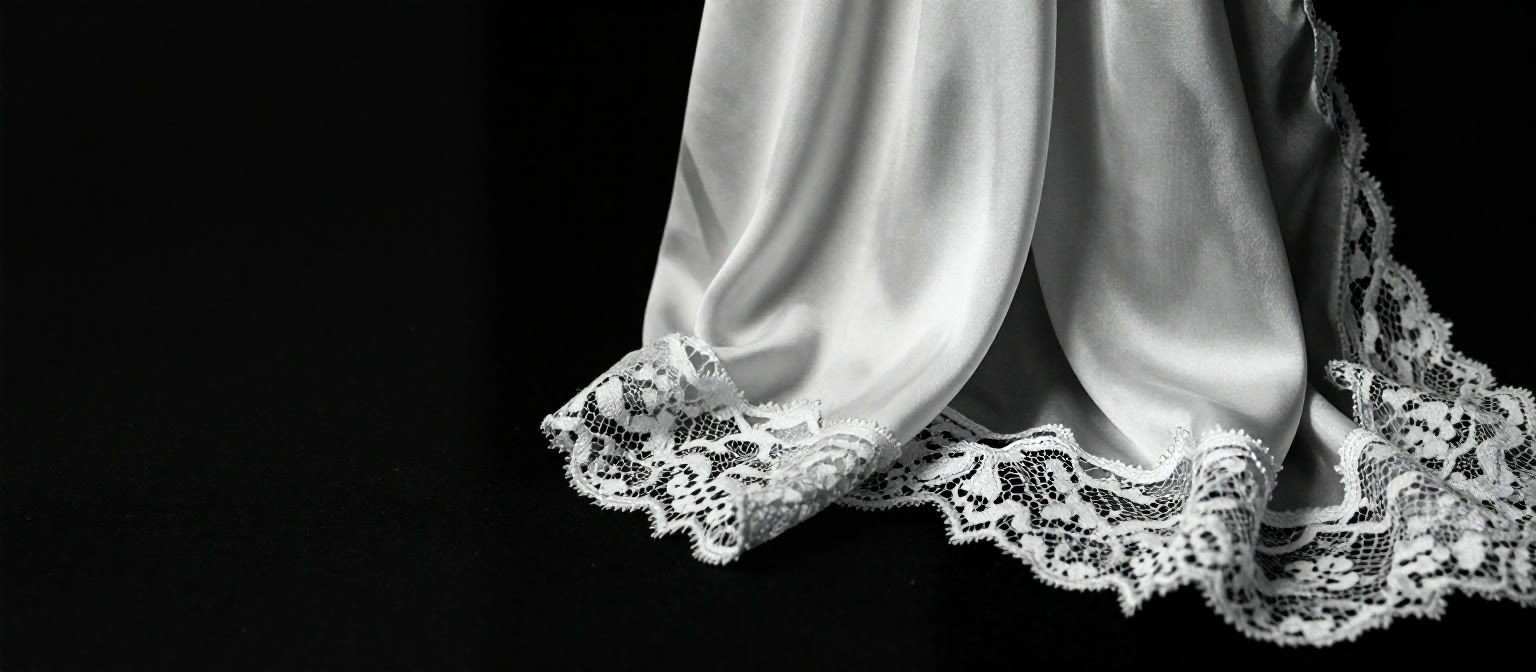 GINA HF — Chantilly lace at the hem of a silk slip